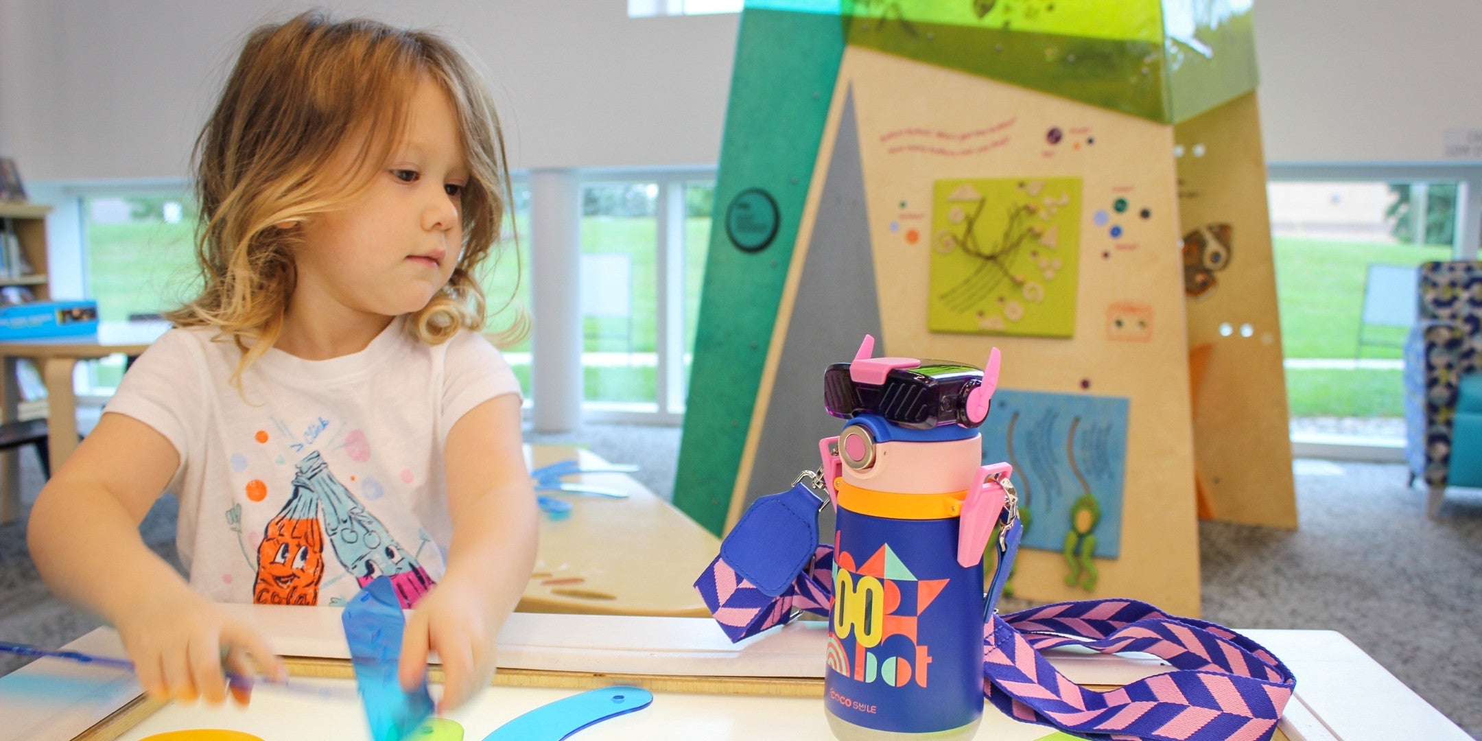 Child playing with colorful toys in a classroom setting