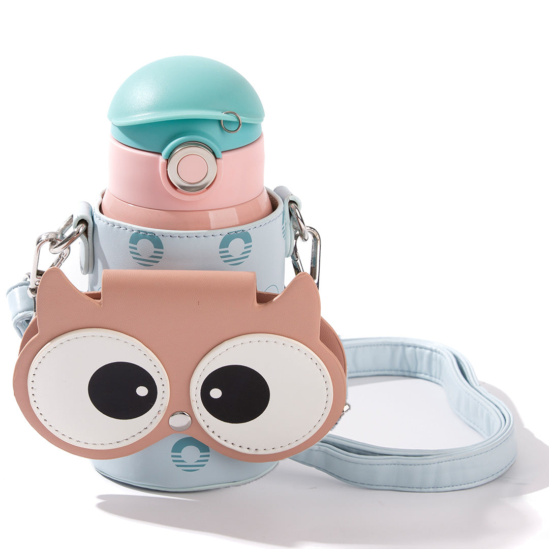 A light blue water bottle with a matching owl-themed bottle cover and shoulder strap, photographed on a clean white background.