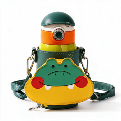 A green water bottle with a matching green shoulder bag featuring a crocodile face design, set against a plain white background.